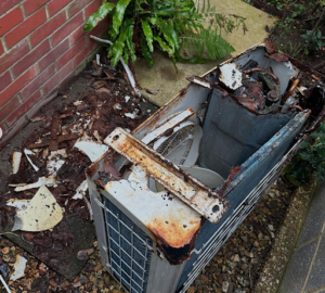 Water damaged outdoor unit after heavy rainfall needing AC Maintenance in Portsmouth 