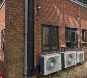 Outdoor air conditioning unit on a Portsmouth coastal property requiring specialist AC maintenance