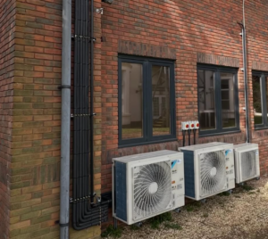 Outdoor air conditioning unit in summer heat Portsmouth